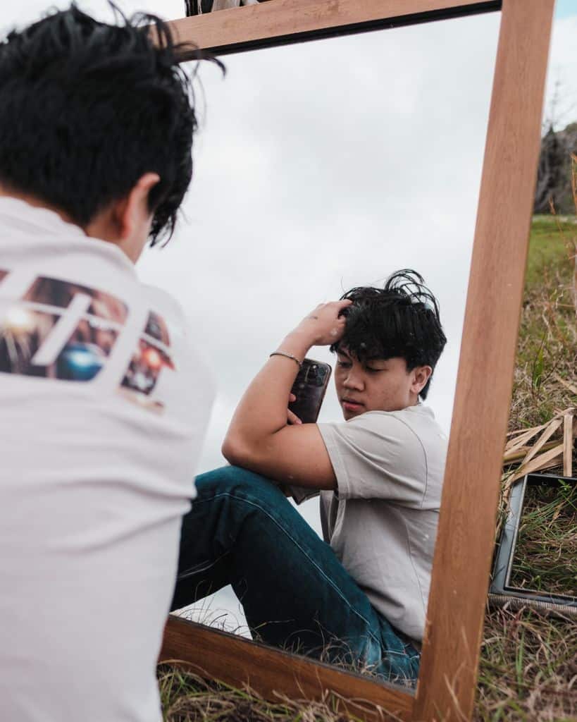 Person practicing peaceful self reflection while considering personal needs and emotional wellbeing
